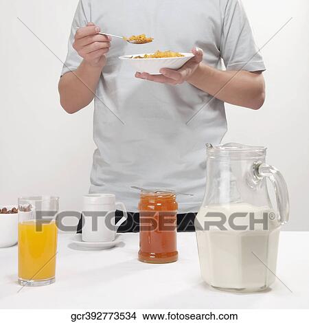 Man having breakfast View Large Photo Image Picture - Man having breakfast. Fotosearch