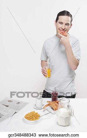 Man having breakfast View Large Photo Image Stock Image - Man having breakfast. Fotosearch