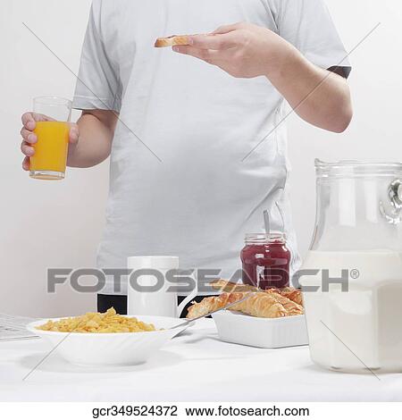 Man having breakfast View Large Photo Image Stock Image - Man having breakfast. Fotosearch