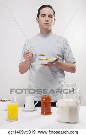 Man having breakfast View Large Photo Image Stock Photo - Man having breakfast. Fotosearch