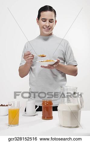 Man having breakfast View Large Photo Image Stock Photograph - Man having breakfast. Fotosearch