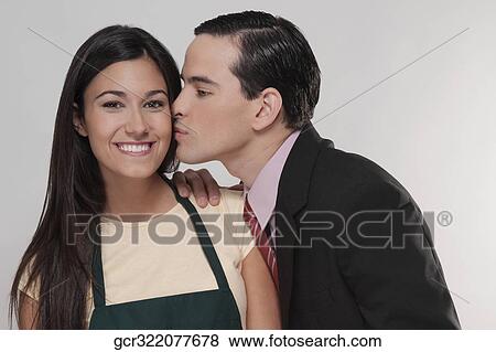 Man kissing a woman View Large Photo Image Stock Photo - Man kissing a woman. Fotosearch