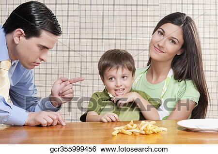 Stock Photograph - Man scolding his son. Fotosearch