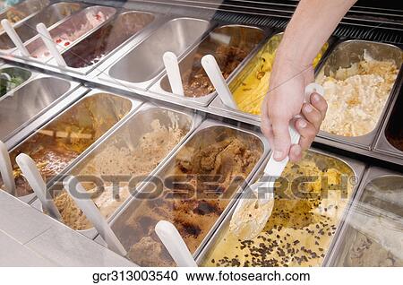 Man's hand taking scoop of ice cream out of container View Large Photo Image Stock Image - Man's hand taking scoop of ice cream out of container. Fotosearch