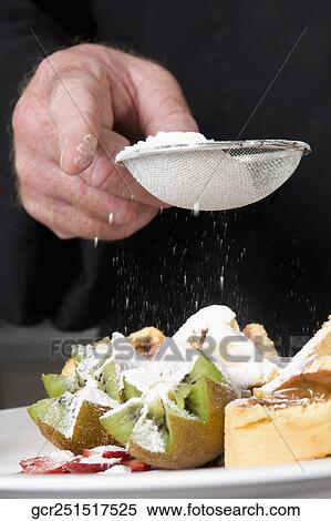 Mid section view of a chef sieving sugar over fruit salad View Large Photo Image Stock Photography - Mid section view of a chef sieving sugar over fruit salad. Fotosearch