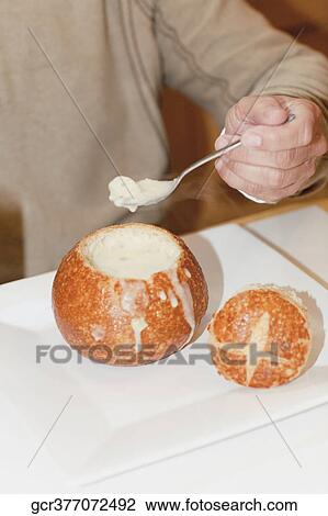 Mid section view of a person eating granadilla View Large Photo Image Stock Image - Mid section view of a person eating granadilla. Fotosearch