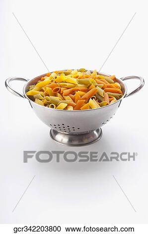 Multi colored rigatoni pasta in a strainer View Large Photo Image Stock Image - Multi colored rigatoni pasta in a strainer. Fotosearch