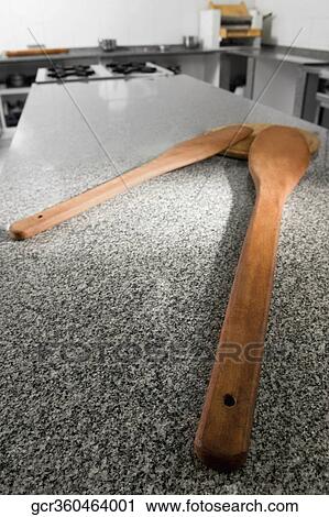 Pizza cutter on a cutting board in the kitchen View Large Photo Image Stock Image - Pizza cutter on a cutting board in the kitchen. Fotosearch