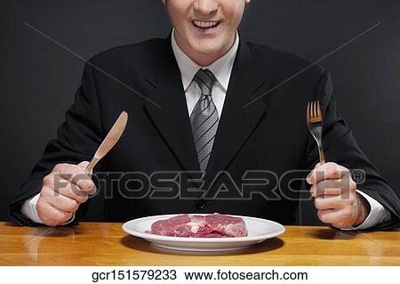 Plate of raw steak in front of a businessman View Large Photo Image Stock Image - Plate of raw steak in front of a businessman. Fotosearch