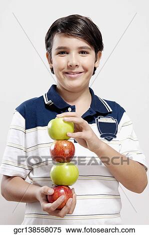 Portrait of a boy holding apples View Large Photo Image Stock Photography - Portrait of a boy holding apples. Fotosearch