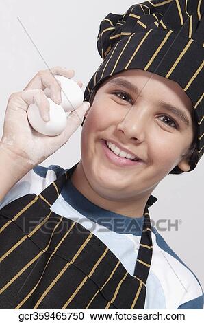Portrait of a boy holding eggs View Large Photo Image Stock Image - Portrait of a boy holding eggs. Fotosearch