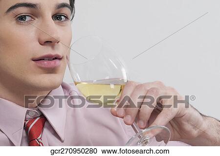 Portrait of a businessman drinking wine View Large Photo Image Stock Image - Portrait of a businessman drinking wine. Fotosearch