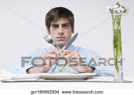 Portrait of a businessman waiting for dinner View Large Photo Image Picture - Portrait of a businessman waiting for dinner. Fotosearch