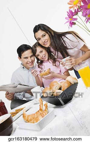 Portrait of a family at the breakfast table View Large Photo Image Stock Photo - Portrait of a family at the breakfast table. Fotosearch