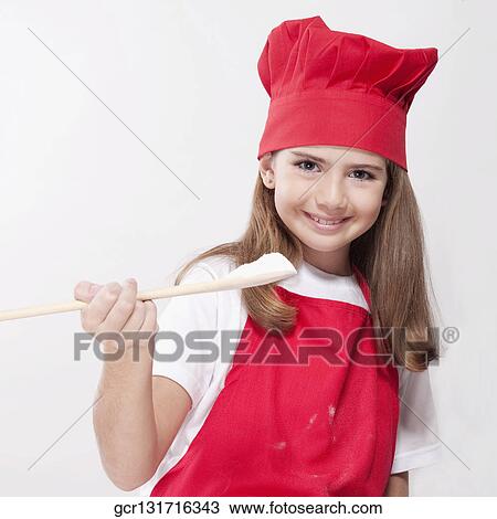 Portrait of a girl holding a wooden spoon with flour View Large Photo Image Stock Image - Portrait of a girl holding a wooden spoon with flour. Fotosearch