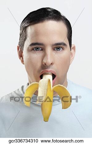 Portrait of a man eating a banana View Large Photo Image Stock Image - Portrait of a man eating a banana. Fotosearch