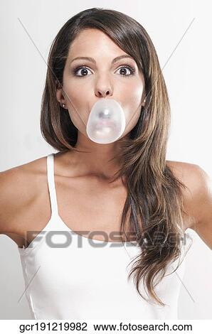 Portrait of a woman blowing a bubble View Large Photo Image Stock Image - Portrait of a woman blowing a bubble. Fotosearch