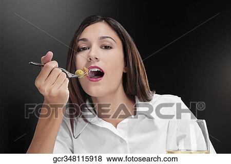 Portrait of a woman eating salad View Large Photo Image Stock Photo - Portrait of a woman eating salad. Fotosearch