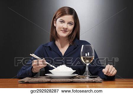 Portrait of a woman having rice and wine View Large Photo Image Stock Photo - Portrait of a woman having rice and wine. Fotosearch