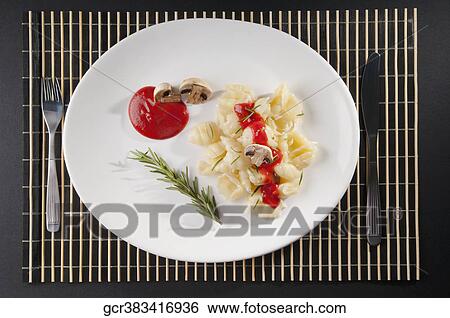 Rosemary garnish on conchiglie pasta with mushrooms View Large Photo Image Stock Photograph - Rosemary garnish on conchiglie pasta with mushrooms. Fotosearch