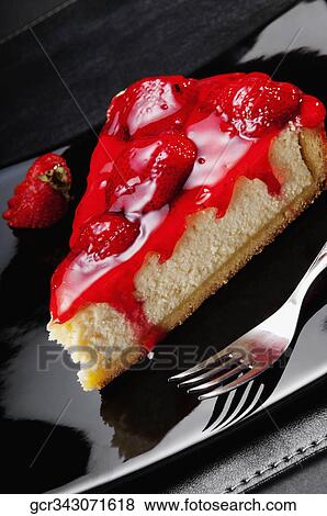 Slice of strawberry cheesecake with strawberries and a fork View Large Photo Image Stock Photo - Slice of strawberry cheesecake with strawberries and a fork. Fotosearch