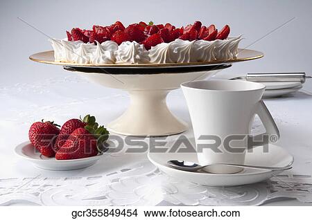 Strawberry meringue served with a cup of coffee View Large Photo Image Picture - Strawberry meringue served with a cup of coffee. Fotosearch