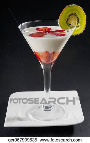 Strawberry slices in a glass of milk View Large Photo Image Stock Photography - Strawberry slices in a glass of milk. Fotosearch