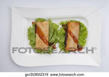 Stuffed spring rolls with green lettuce View Large Photo Image Stock Photo - Stuffed spring rolls with green lettuce. Fotosearch