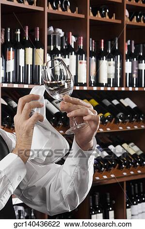 Waiter polishing a wine glass View Large Photo Image Stock Image - Waiter polishing a wine glass. Fotosearch
