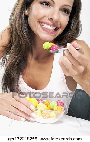 Woman eating cereal View Large Photo Image Stock Photography - Woman eating cereal. Fotosearch