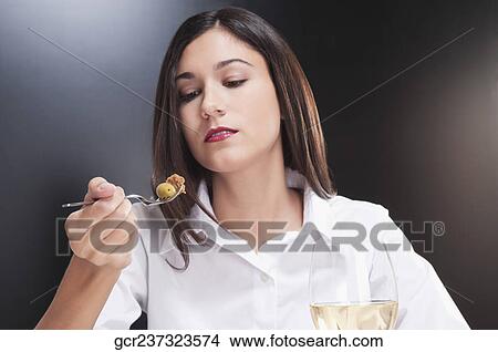 Woman eating salad View Large Photo Image Picture - Woman eating salad. Fotosearch