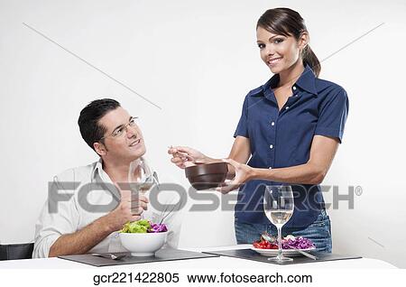Woman feeding her husband from a bowl View Large Photo Image Stock Photography - Woman feeding her husband from a bowl. Fotosearch