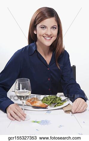 Woman having lunch View Large Photo Image Stock Image - Woman having lunch. Fotosearch