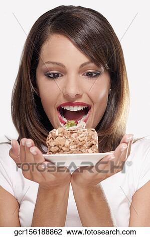 Woman holding a pastry on a plate View Large Photo Image Stock Image - Woman holding a pastry on a plate. Fotosearch