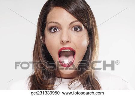 Woman with mint candy on her tongue View Large Photo Image Stock Image - Woman with mint candy on her tongue . Fotosearch