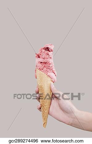 Woman's hand holding an ice cream View Large Photo Image Stock Photograph - Woman's hand holding an ice cream. Fotosearch