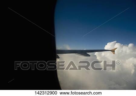 Airplane in flight in the sky View Large Photo Image Stock Image - Airplane in flight in the sky. Fotosearch