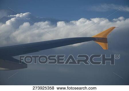 Airplane in flight in the sky View Large Photo Image Stock Photo - Airplane in flight in the sky. Fotosearch