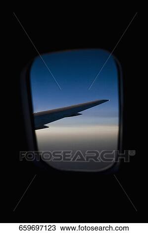 Airplane viewed through the window of another airplane View Large Photo Image Stock Image - Airplane viewed through the window of another airplane. Fotosearch
