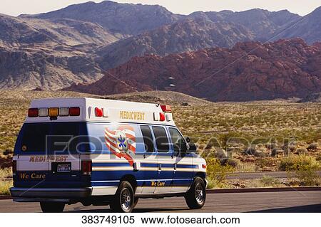 Ambulance on the road passing through an arid landscape, Las Vegas, Nevada, USA View Large Photo Image Stock Photography - Ambulance on the road passing through an arid landscape, Las Vegas, Nevada, USA. Fotosearch
