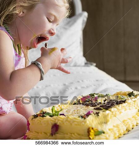 Baby girl eating birthday cake View Large Photo Image Stock Photograph - Baby girl eating birthday cake. Fotosearch