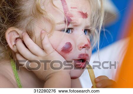 Baby girl eating French fries View Large Photo Image Stock Photograph - Baby girl eating French fries. Fotosearch