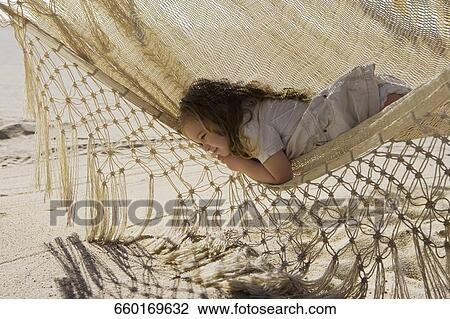 Baby girl lying in a hammock, Cabo San Lucas, Mexico View Large Photo Image Stock Image - Baby girl lying in a hammock, Cabo San Lucas, Mexico. Fotosearch