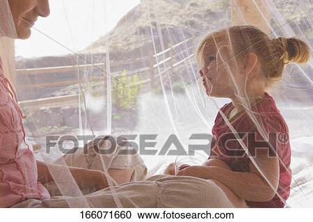 Baby girl with her mother in the bedroom View Large Photo Image Stock Image - Baby girl with her mother in the bedroom. Fotosearch