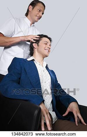 Barber massaging a man's head View Large Photo Image Stock Image - Barber massaging a man's head. Fotosearch