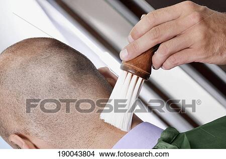 Barber using a brush on a man's neck View Large Photo Image Picture - Barber using a brush on a man's neck. Fotosearch