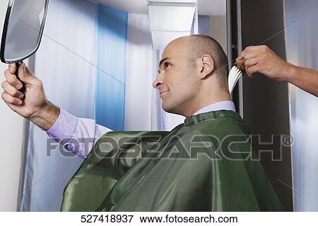 Barber using a brush on a man's neck View Large Photo Image Stock Photo - Barber using a brush on a man's neck. Fotosearch