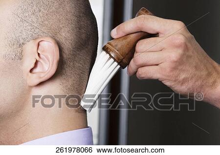Barber using a brush on a man's neck View Large Photo Image Stock Photograph - Barber using a brush on a man's neck. Fotosearch