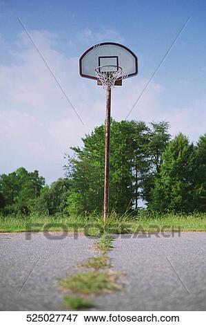 Basketball hoop in a park View Large Photo Image Stock Photo - Basketball hoop in a park. Fotosearch
