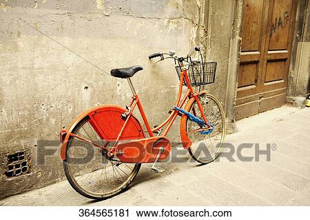 Bicycle leaning against a wall View Large Photo Image Stock Image - Bicycle leaning against a wall. Fotosearch